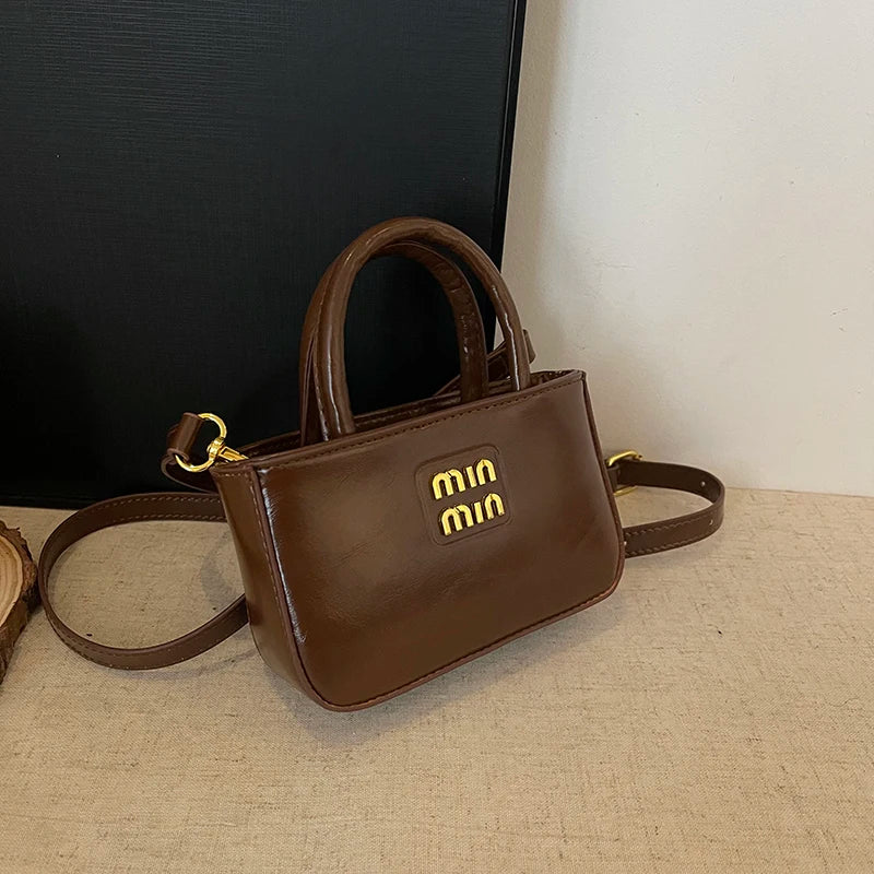 Super fire exquisite mini small bag female 2025 new high-end light luxury designer niche design messenger bag lipstick bag