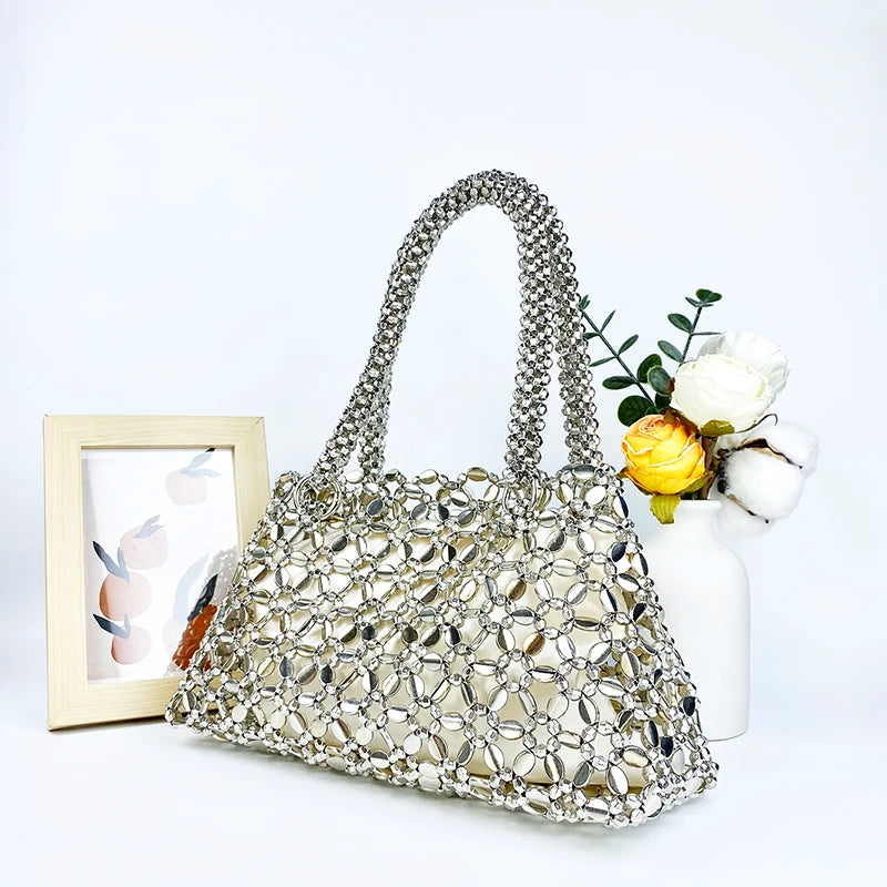 Korean version personalized woven hollowed out high aesthetic ceiling versatile handbag shiny handmade pearl tote underarm bag