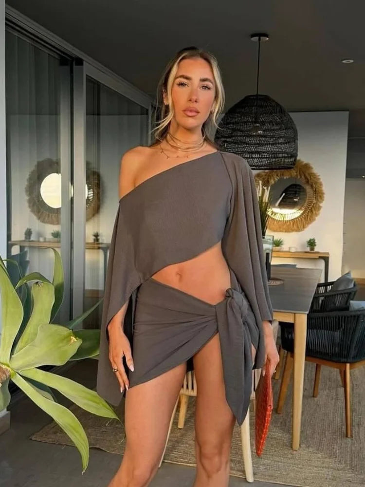 Sexy Solid Pleated Knot Mini Skirts Sets For Women Chic One Shoulder Flared Sleeve Loose Cape Tops Suits 2025 Lady Party Outfits