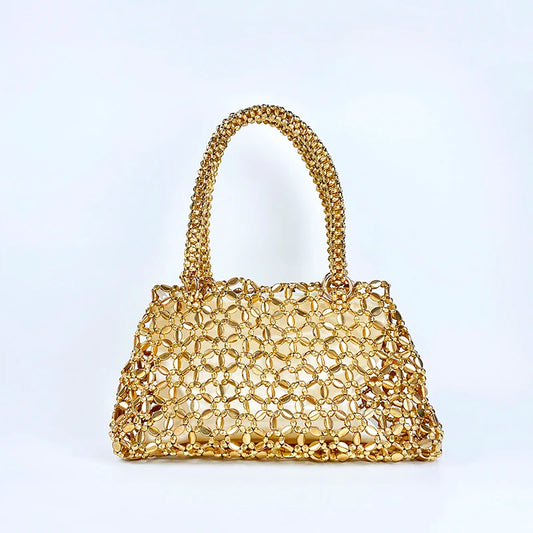 Korean version personalized woven hollowed out high aesthetic ceiling versatile handbag shiny handmade pearl tote underarm bag