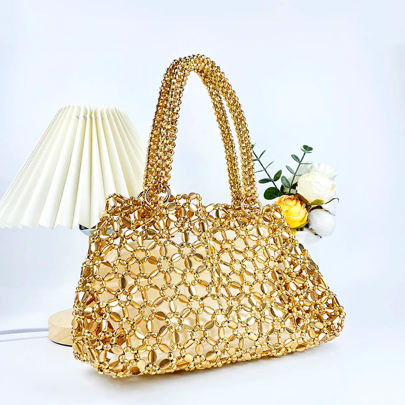 Korean version personalized woven hollowed out high aesthetic ceiling versatile handbag shiny handmade pearl tote underarm bag