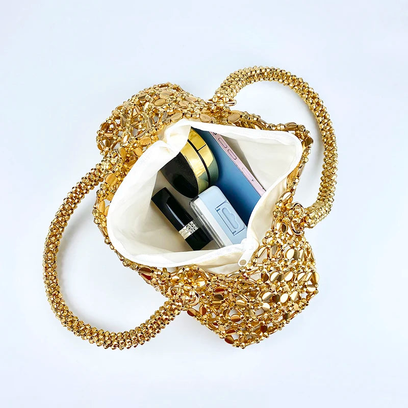Korean version personalized woven hollowed out high aesthetic ceiling versatile handbag shiny handmade pearl tote underarm bag