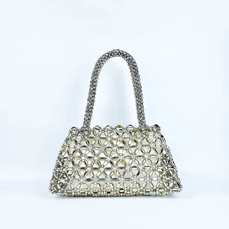 Korean version personalized woven hollowed out high aesthetic ceiling versatile handbag shiny handmade pearl tote underarm bag